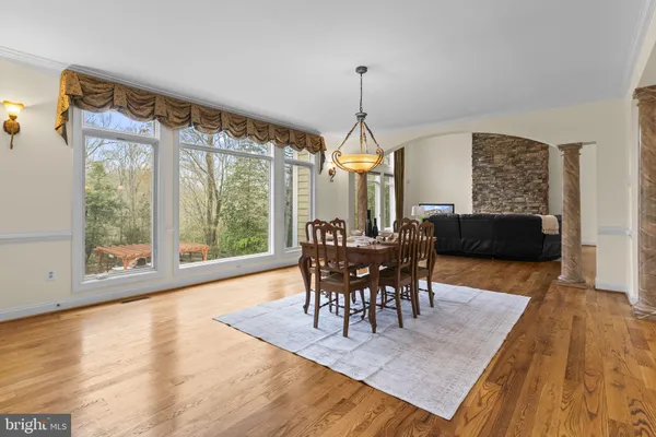 a view of a room with wooden floor and balcony