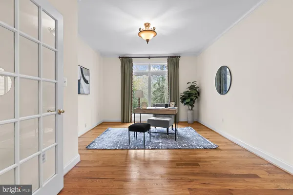 a kitchen with stainless steel appliances granite countertop a kitchen island a stove and a sink