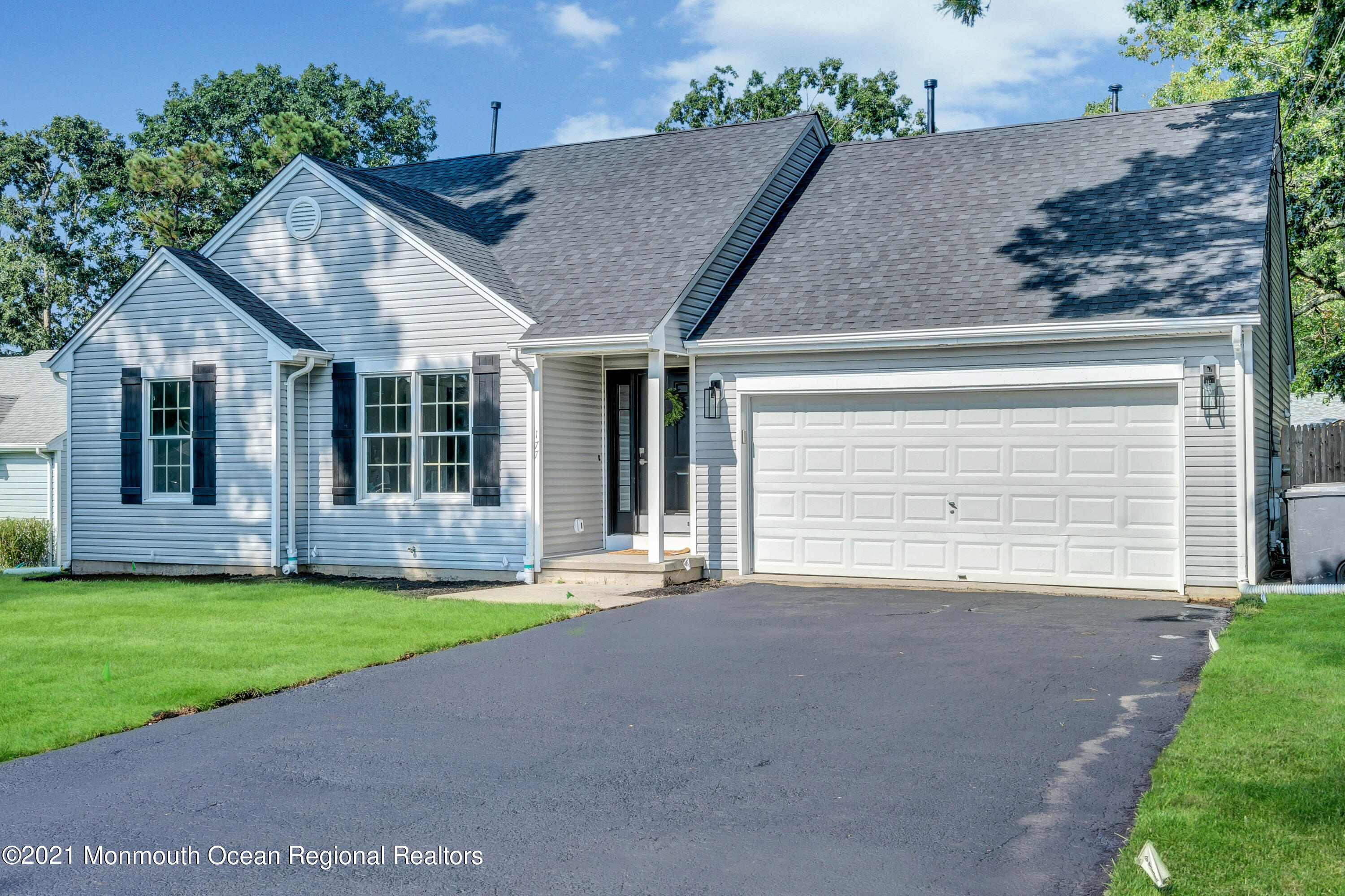 177 Topside Road Manahawkin, NJ 08050 - Photo 2 of 30 a front view of a house with a yard and garage