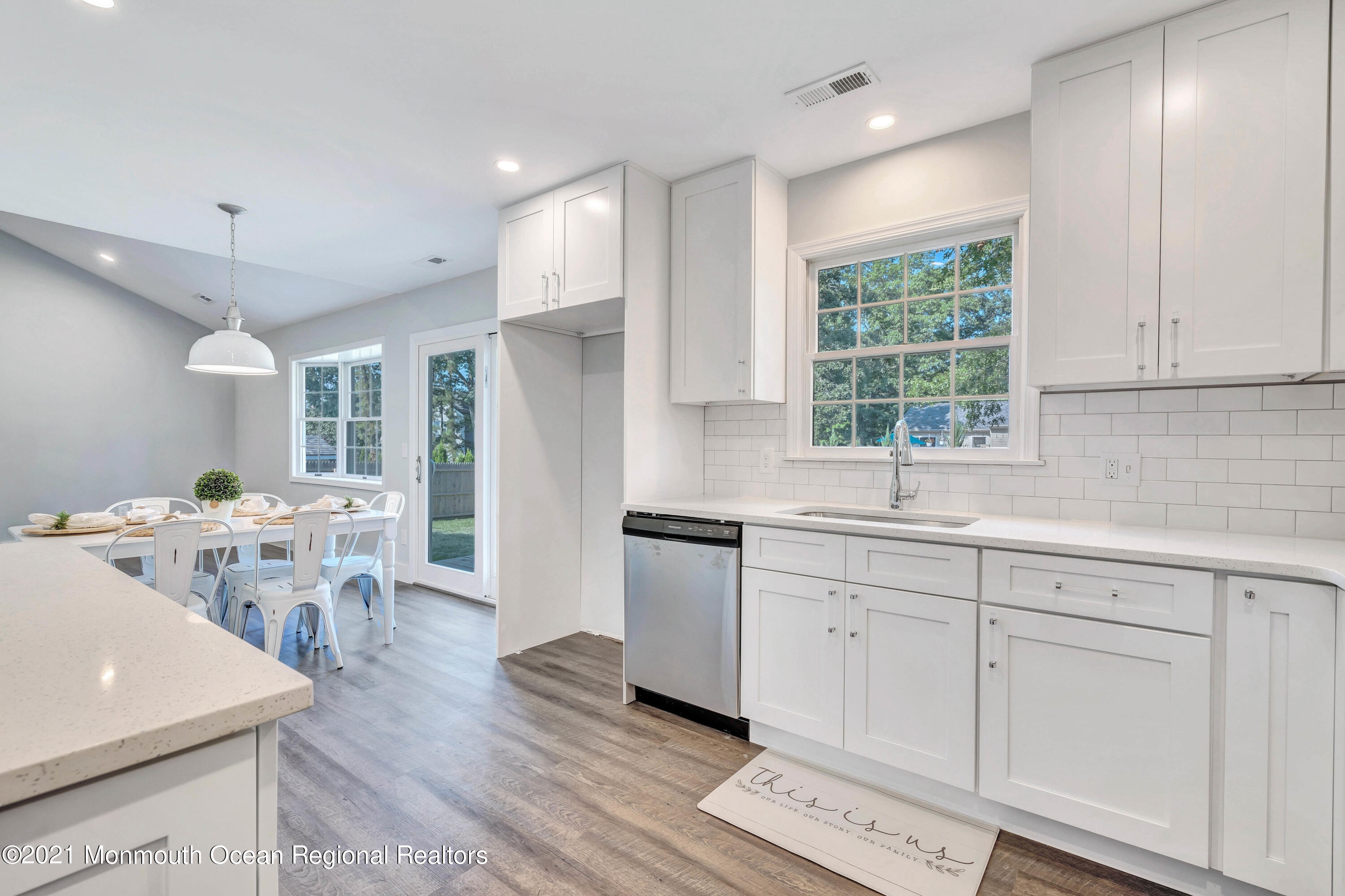 177 Topside Road Manahawkin, NJ 08050 - Photo 15 of 30 a kitchen with sink cabinets and wooden floor