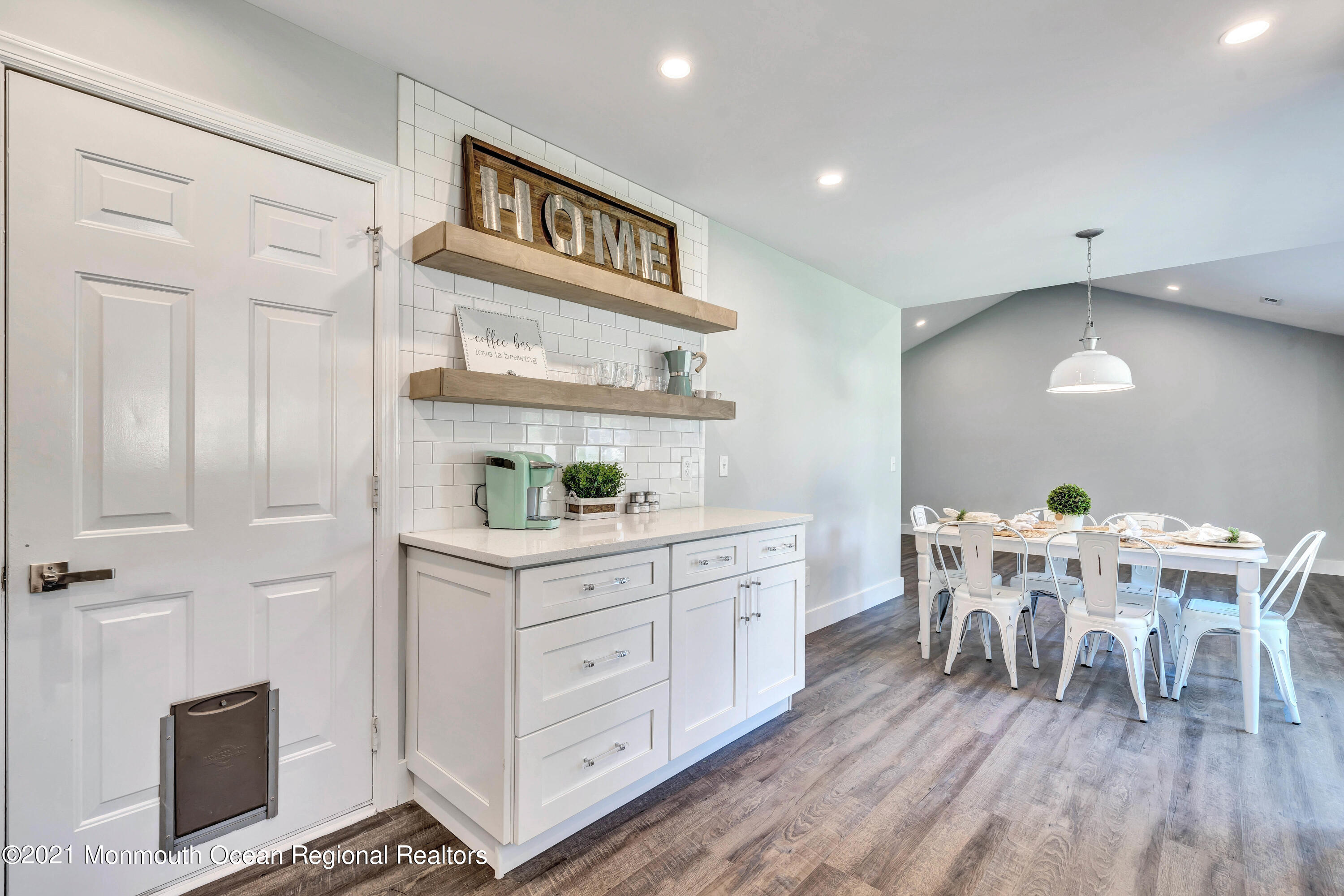 177 Topside Road Manahawkin, NJ 08050 - Photo 16 of 30 a view of a kitchen with dining table and chairs