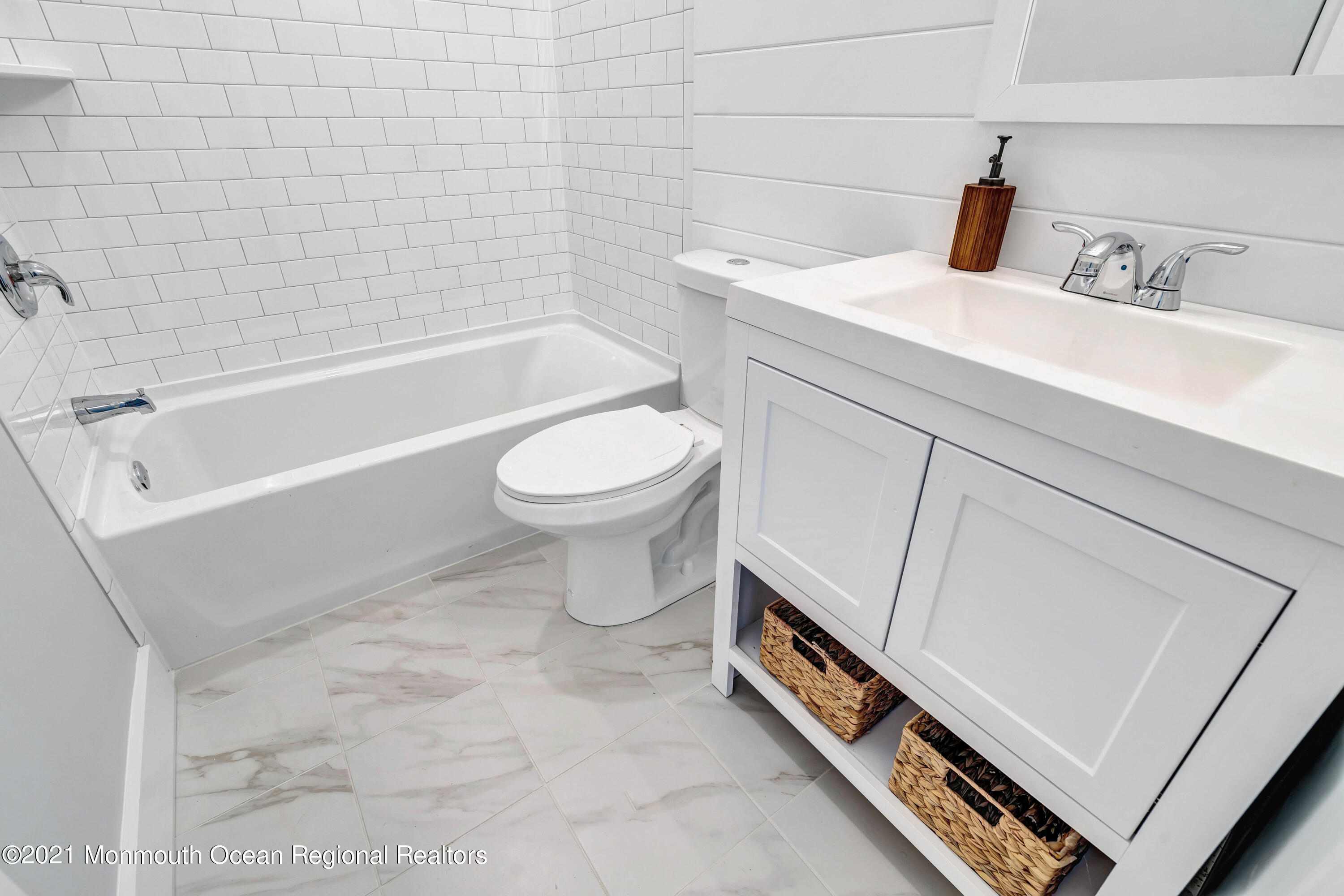 177 Topside Road Manahawkin, NJ 08050 - Photo 18 of 30 a bathroom with a sink a toilet and bathtub