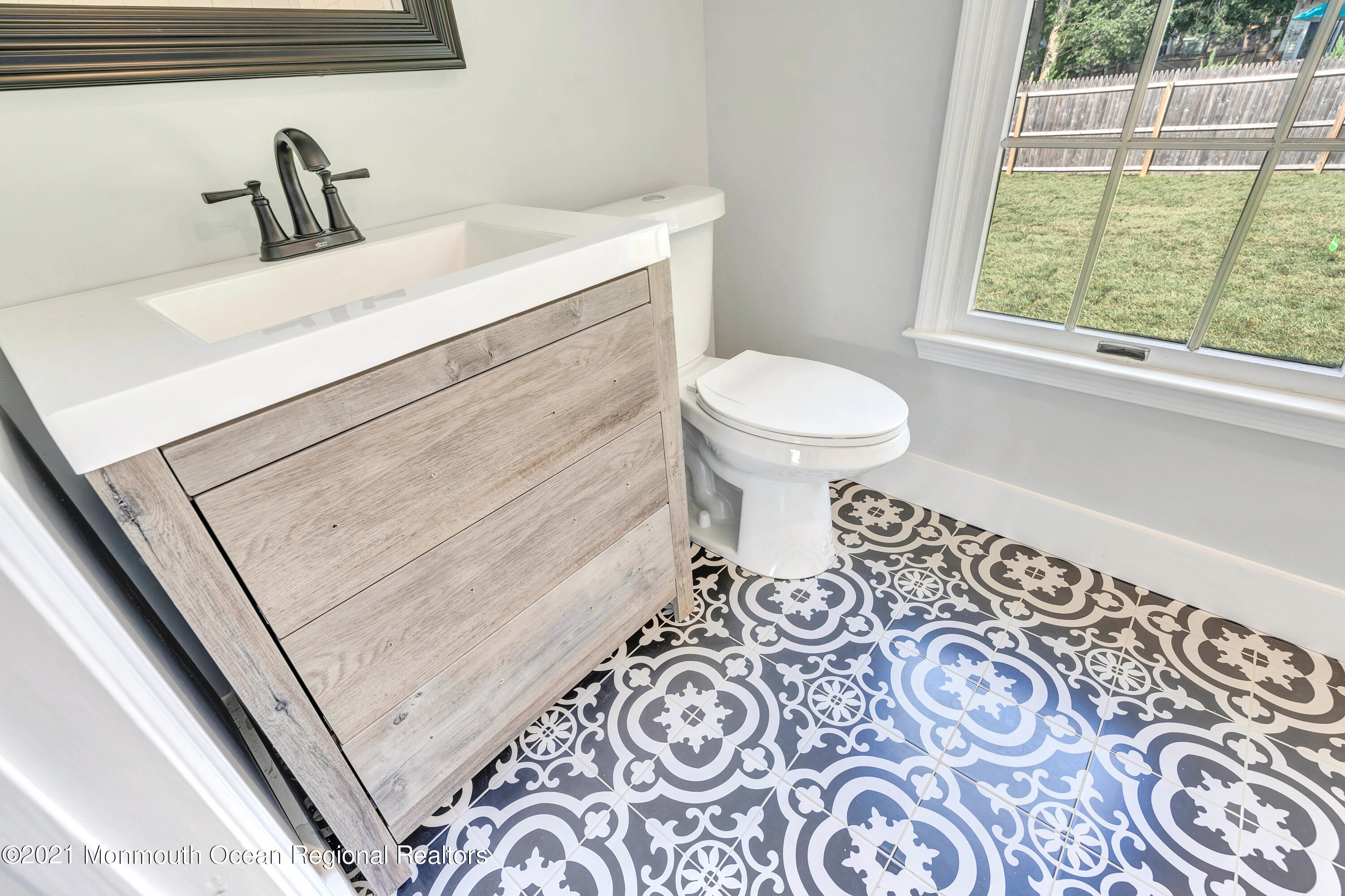 177 Topside Road Manahawkin, NJ 08050 - Photo 25 of 30 a bathroom with a sink and a toilet