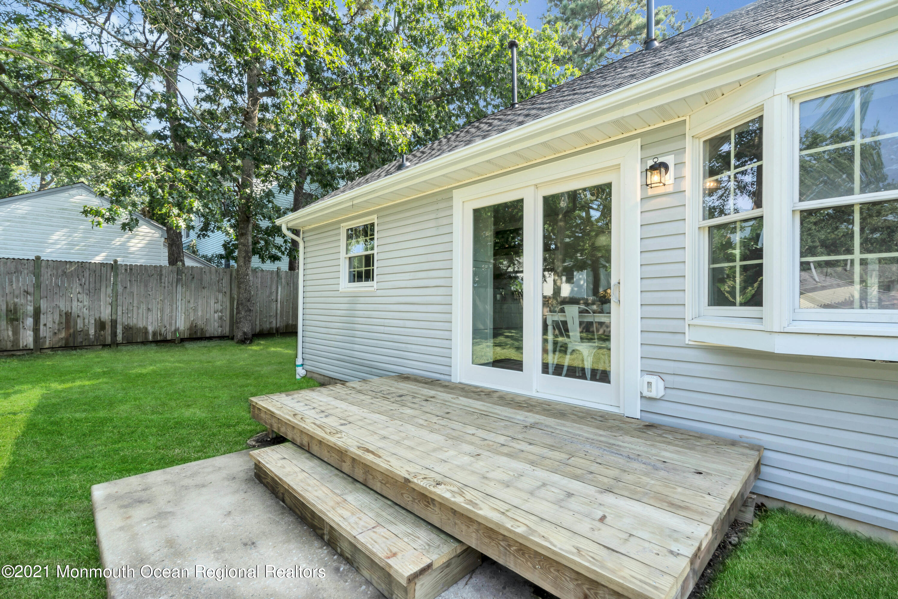 177 Topside Road Manahawkin, NJ 08050 - Photo 30 of 30 a view of a backyard with plants and large tree