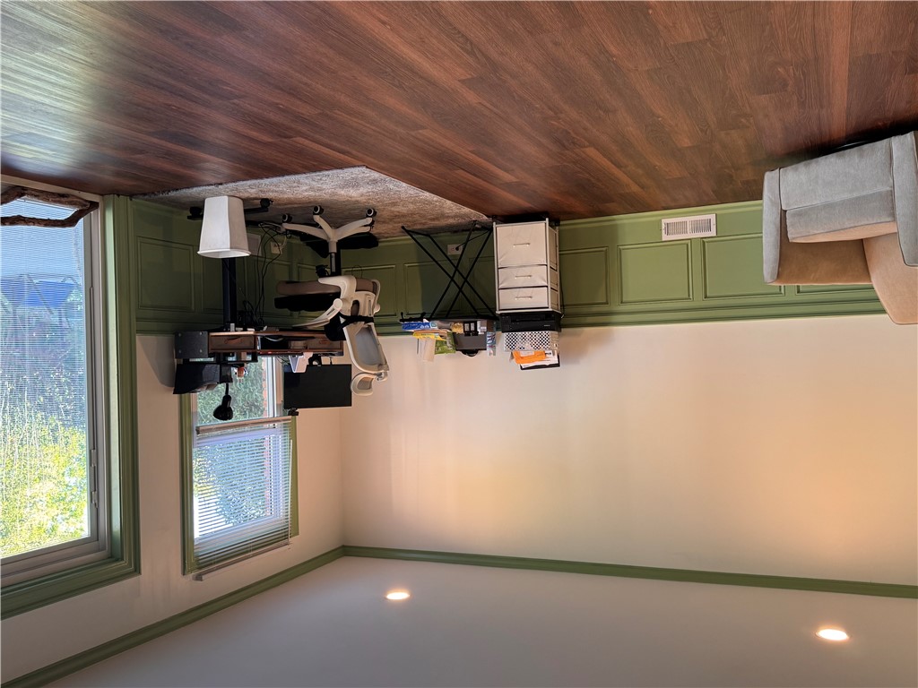 2211 East River Street Anderson, SC 29621 - Photo 24 of 40 This versatile room features warm flooring and ample natural light, ideal for a productive home office.