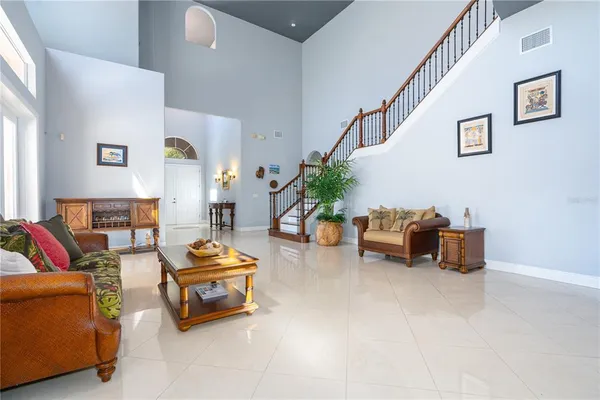 a room with furniture and a ceiling fan