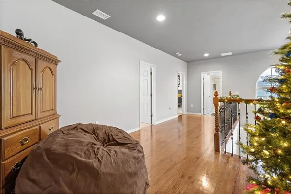 a view of entryway with wooden floor