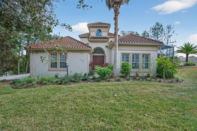 front view of a house with a yard