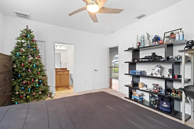 a bedroom with a bed and a couch