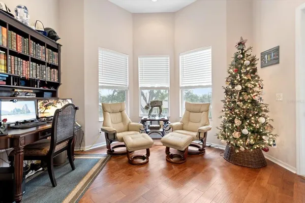 a view of a dining room with furniture window and wooden floor