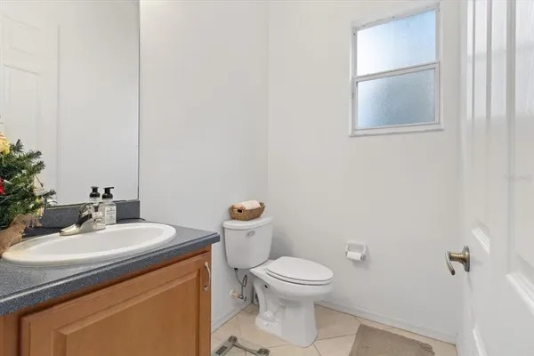 a view of a porch with furniture and a potted plant