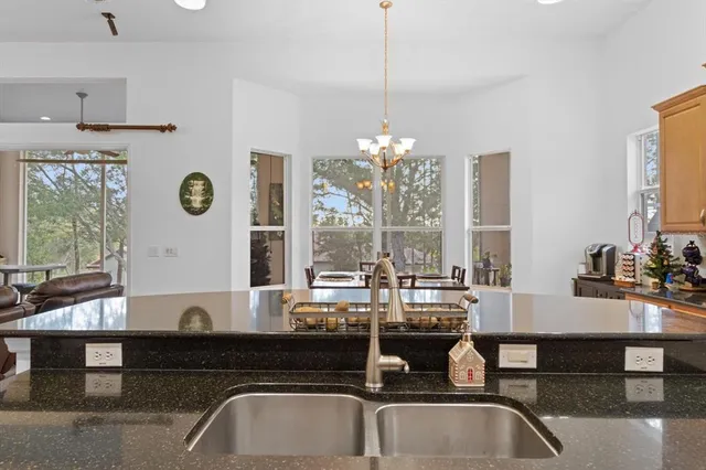 a view of a porch with furniture and a potted plant