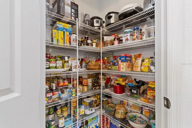 a view of a porch with furniture and a potted plant