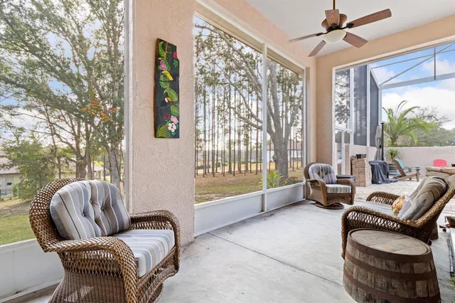 a view of a house with a yard and sitting area
