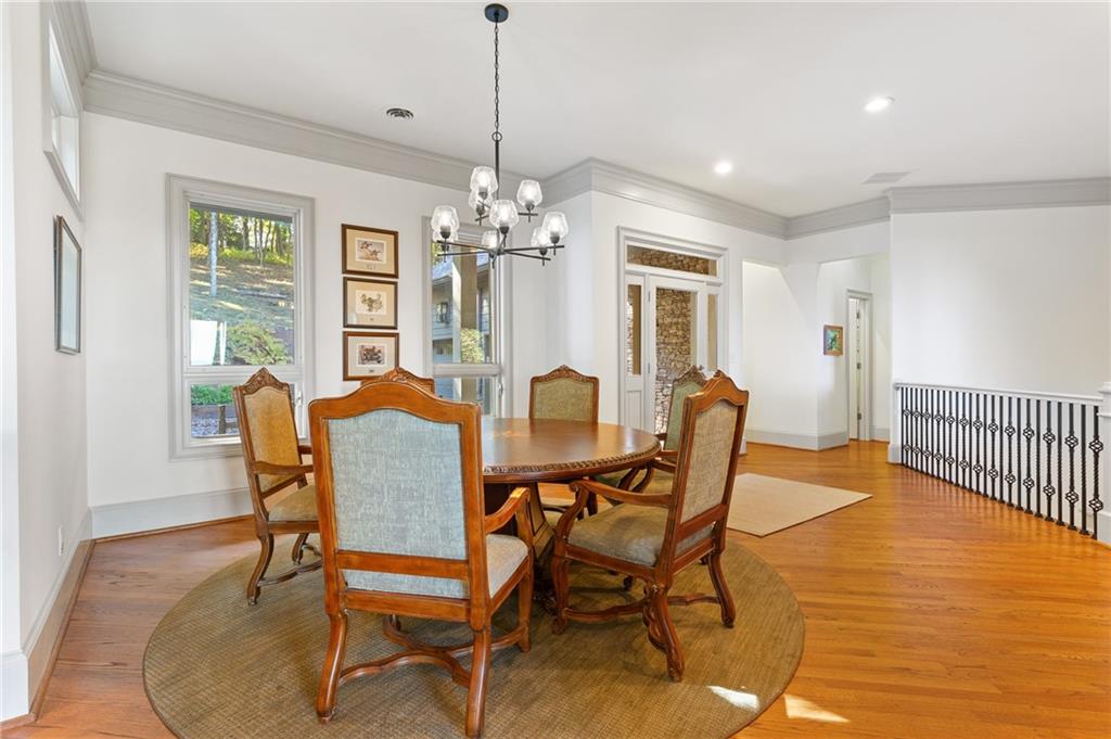 1319 Deer Run Ridge Jasper, GA 30143 - Photo 13 of 67 a dining room with furniture a chandelier and wooden floor