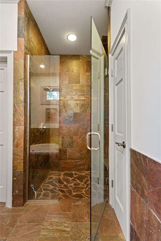 1319 Deer Run Ridge Jasper, GA 30143 - Photo 20 of 67 a bathroom with a glass door shower