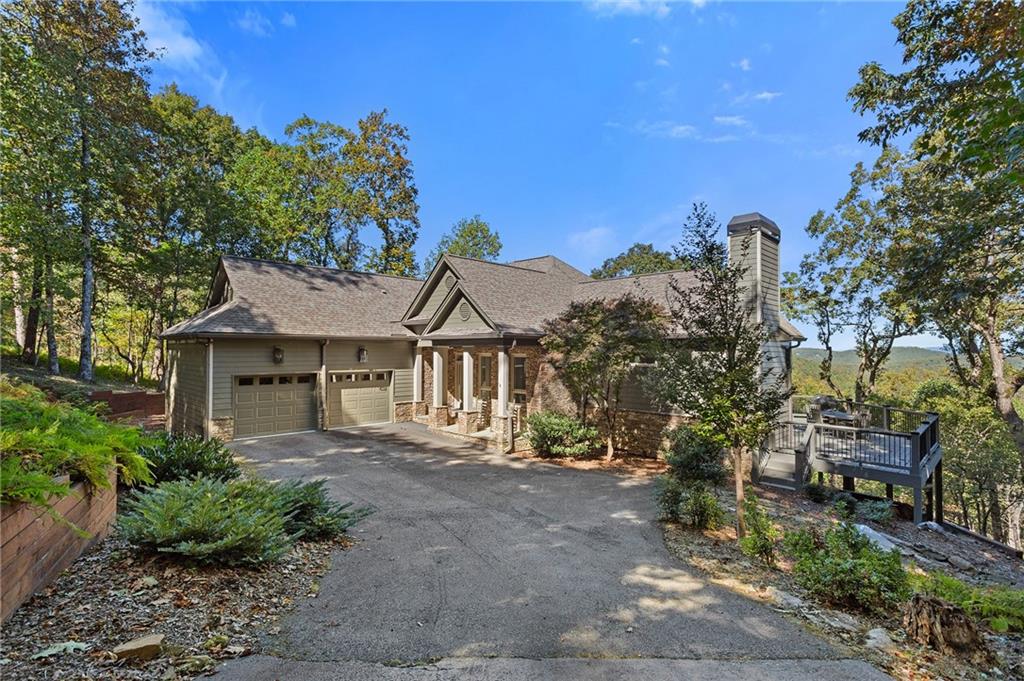 1319 Deer Run Ridge Jasper, GA 30143 - Photo 2 of 67 a front view of a house with a garden