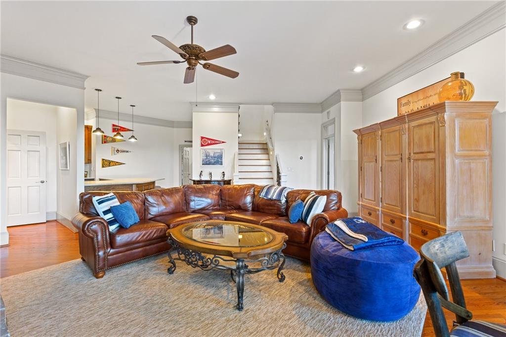 1319 Deer Run Ridge Jasper, GA 30143 - Photo 27 of 67 a living room with furniture a ceiling fan and a rug