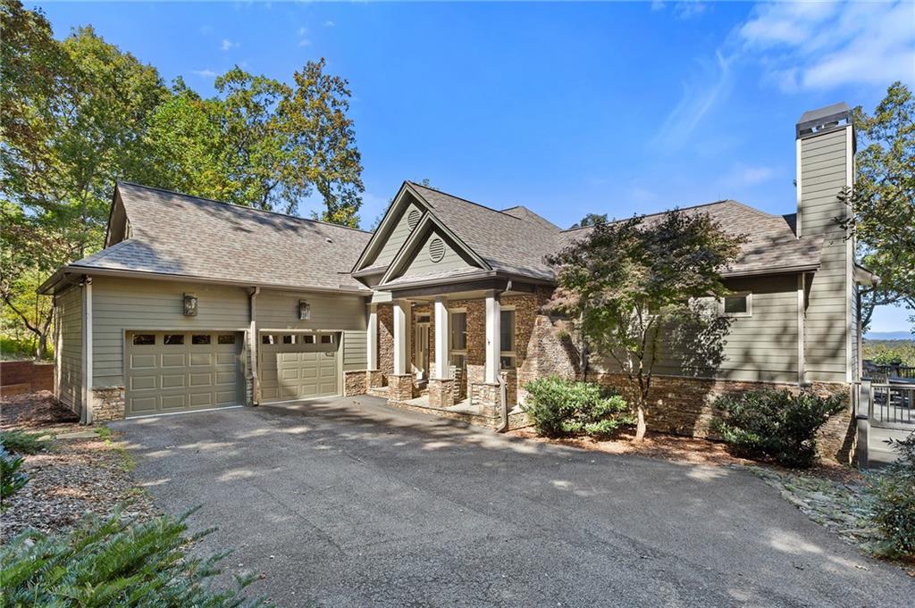 1319 Deer Run Ridge Jasper, GA 30143 - Photo 3 of 67 a view of a house with a yard and garage