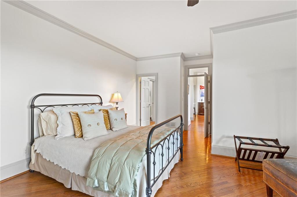 1319 Deer Run Ridge Jasper, GA 30143 - Photo 32 of 67 a bedroom with a bed and wooden floor