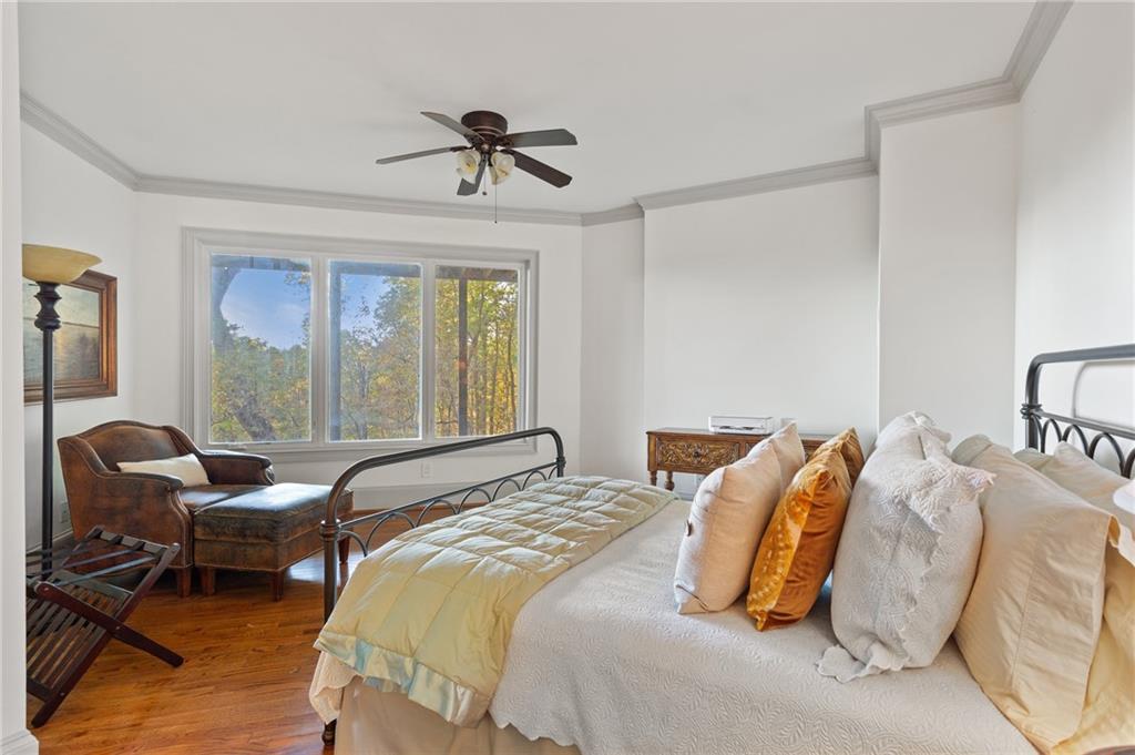 1319 Deer Run Ridge Jasper, GA 30143 - Photo 33 of 67 a bedroom with bed and windows