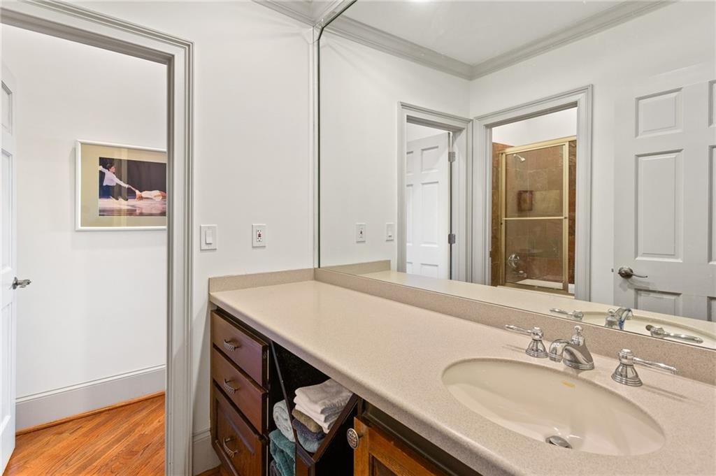 1319 Deer Run Ridge Jasper, GA 30143 - Photo 34 of 67 a bathroom with a sink and a mirror