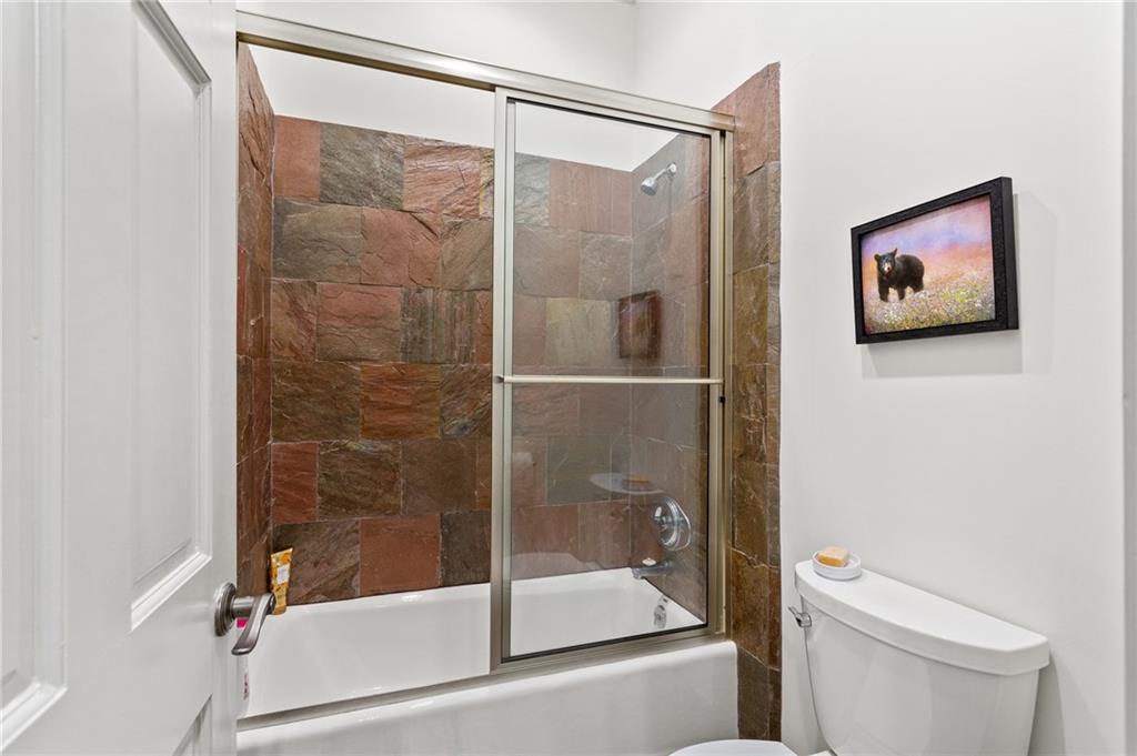 1319 Deer Run Ridge Jasper, GA 30143 - Photo 35 of 67 a bathroom with a shower and a toilet with a shower