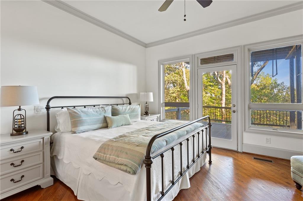 1319 Deer Run Ridge Jasper, GA 30143 - Photo 39 of 67 a bedroom with a balcony a bed and a large window