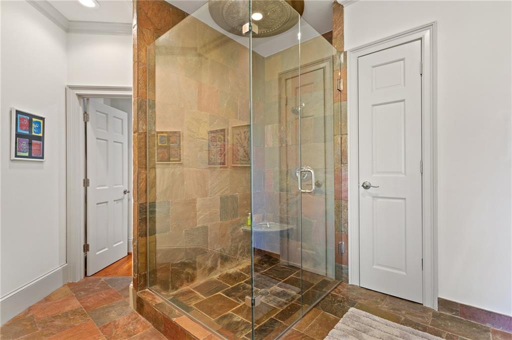 1319 Deer Run Ridge Jasper, GA 30143 - Photo 43 of 67 a bathroom with a glass shower door and a bathtub