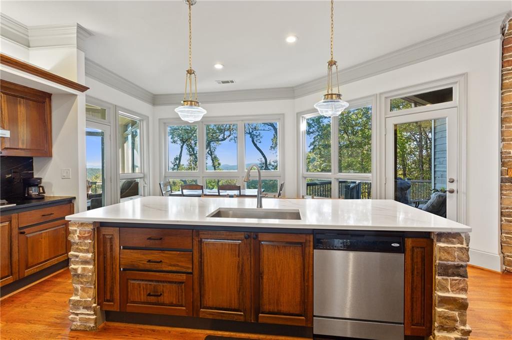 1319 Deer Run Ridge Jasper, GA 30143 - Photo 7 of 67 a kitchen with a stove a sink a window and dining table