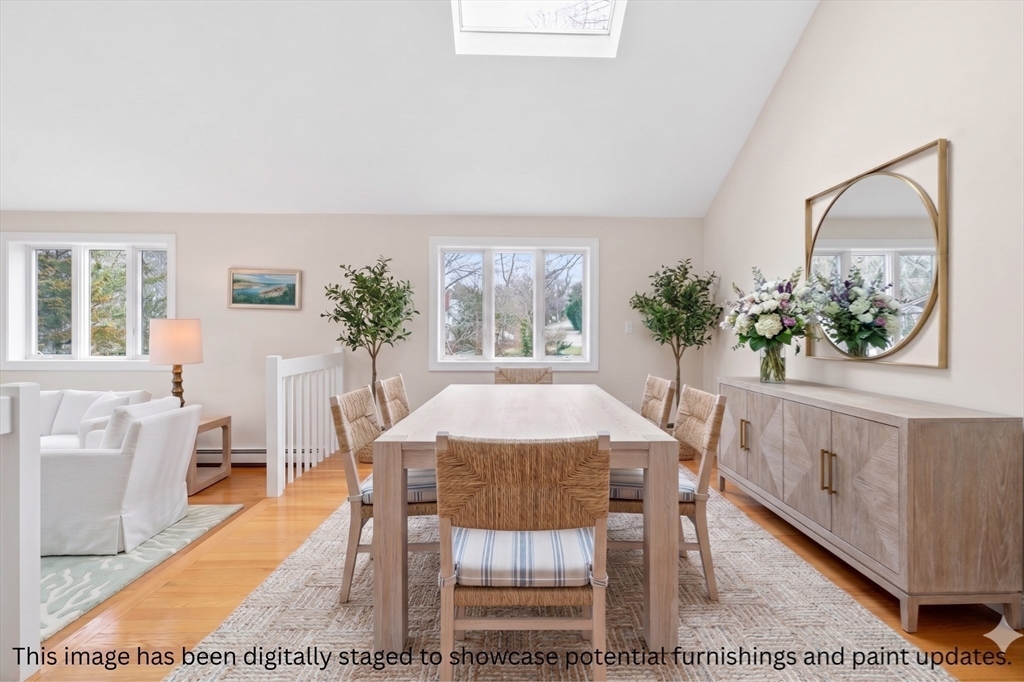 32 Howe Road Cohasset, MA 02025 - Photo 4 of 25 a view of a dining room with furniture and a potted plant