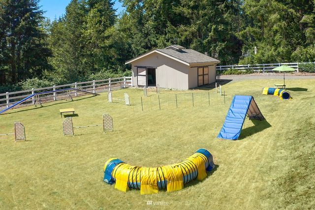 a view of a swimming pool with some chairs
