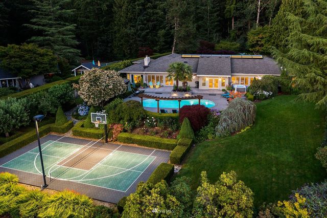 a view of a patio with table and chairs potted plants