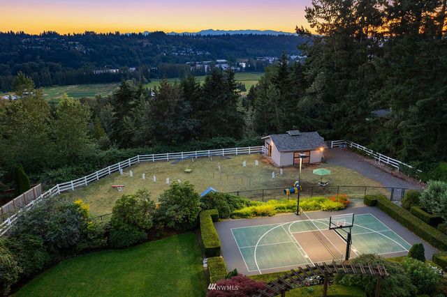 a view of a swimming pool with a table and chairs