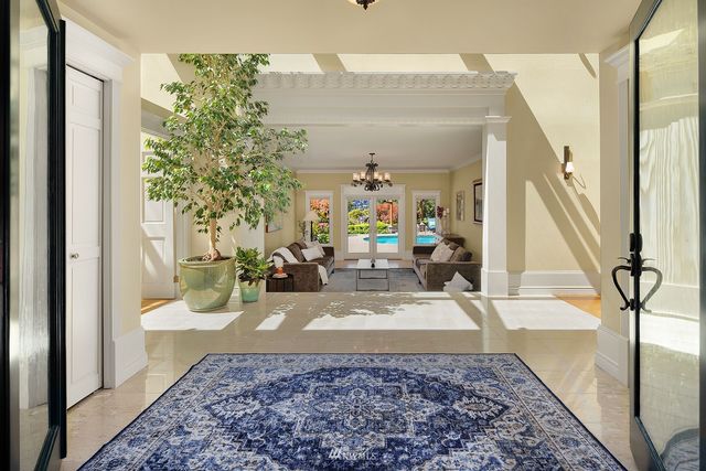 a view of living room with furniture and a rug