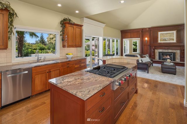 a kitchen with a stove and a sink