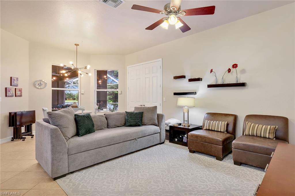 14611 Indigo Lakes Circle Naples, FL 34119 - Photo 11 of 31 a living room with furniture