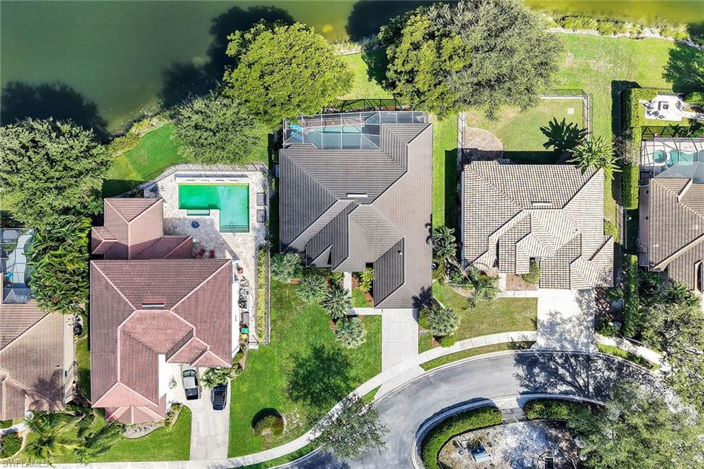 14611 Indigo Lakes Circle Naples, FL 34119 - Photo 20 of 31 an aerial view of a house with a yard and garden
