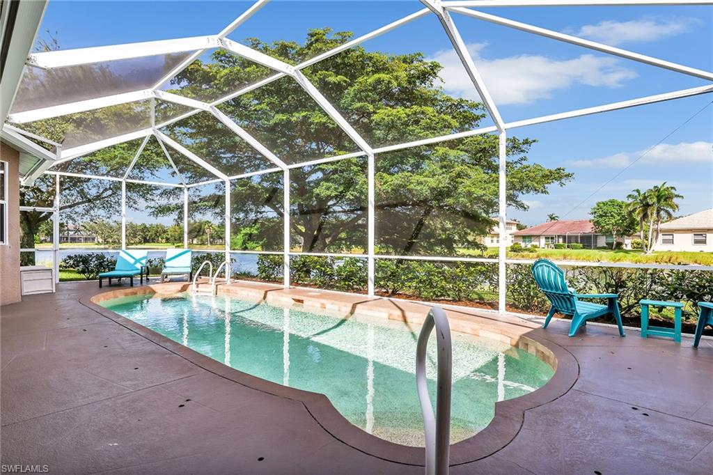 14611 Indigo Lakes Circle Naples, FL 34119 - Photo 2 of 31 a view of a backyard with swimming pool