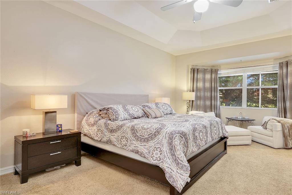 14611 Indigo Lakes Circle Naples, FL 34119 - Photo 22 of 31 a bedroom with a bed and window