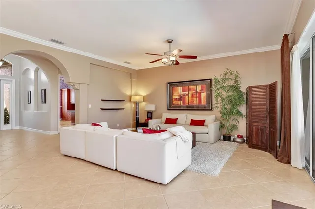 a bedroom with furniture and a flat screen tv