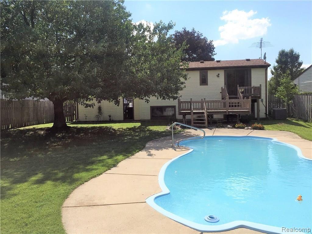 620 Glenwyth Road Brighton, MI 48116 - Photo 9 of 24 View of pool and rear exterior