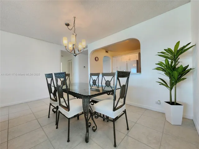 a kitchen with a sink cabinets and stainless steel appliances