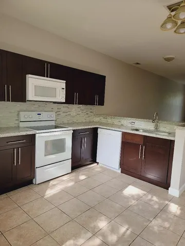 a kitchen with a stove and a sink