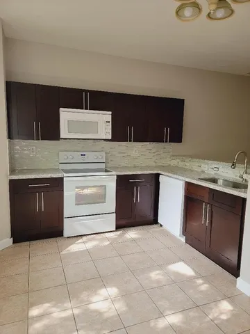 a kitchen with a cabinets and sink