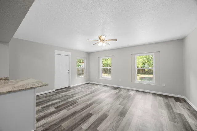 a view of an empty room with a window