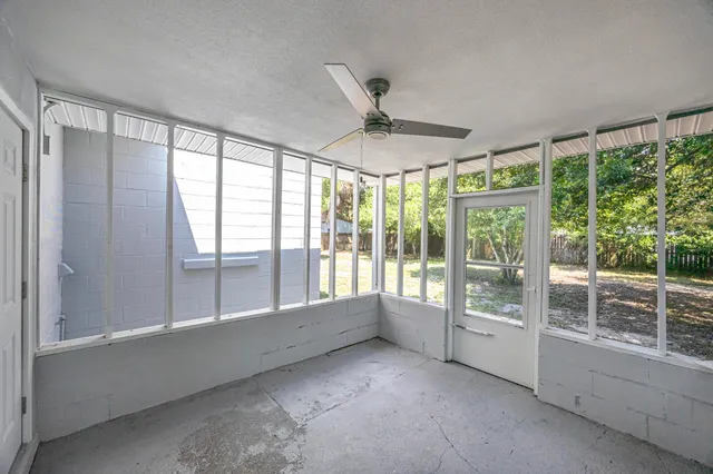 a view of an empty room with a window