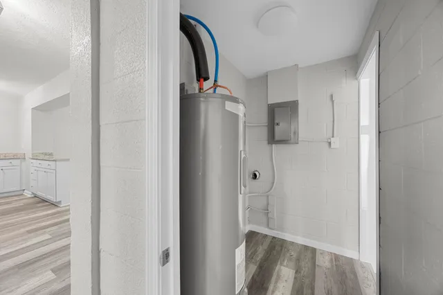 a view of a room with a ceiling fan and a window
