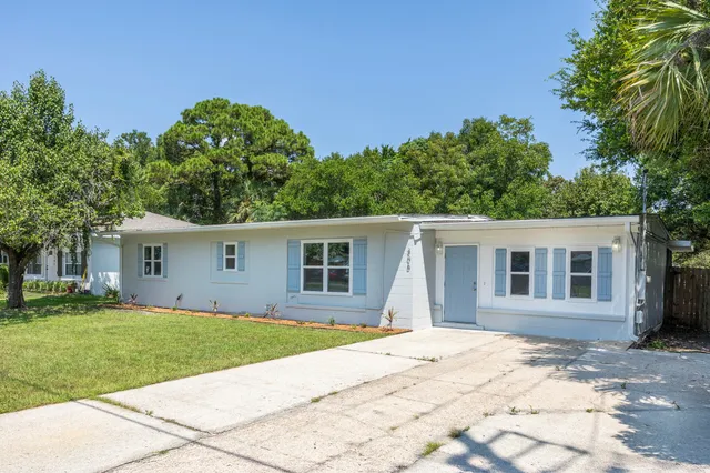 front view of a house with a yard