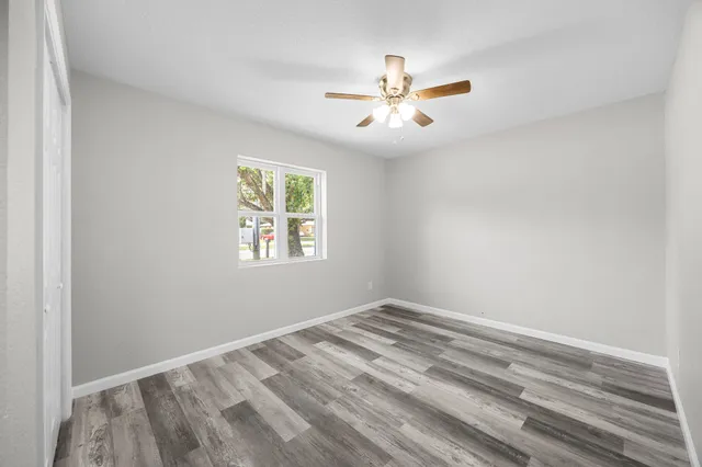 a bathroom with a toilet sink and shower